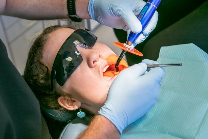 patient getting a dental procedure done at Oakville dental office Jacobs & Associates