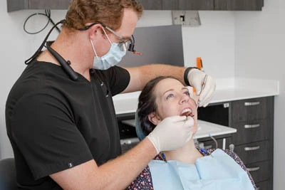 cosmetic dentistry patient having work done in dental chair